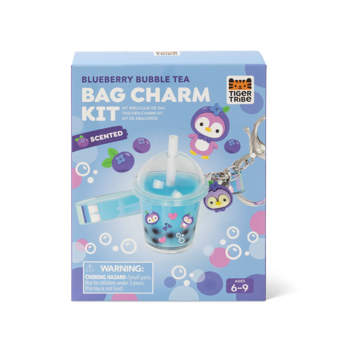 Tiger Tribe Blueberry Bubble Tea Bag Charm Kit in its original packaging, featuring a light blue box with illustrations of a penguin and a bubble tea cup charm.
