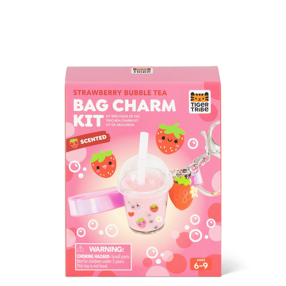 Tiger Tribe Strawberry Bubble Tea Bag Charm Kit in a pink box, featuring illustrations of a strawberry drink and a charm, on a white background.