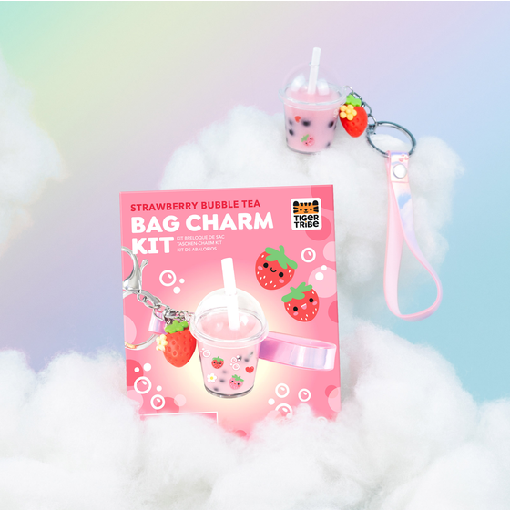 Strawberry bubble tea bag charm kit with packaging on a cloud background