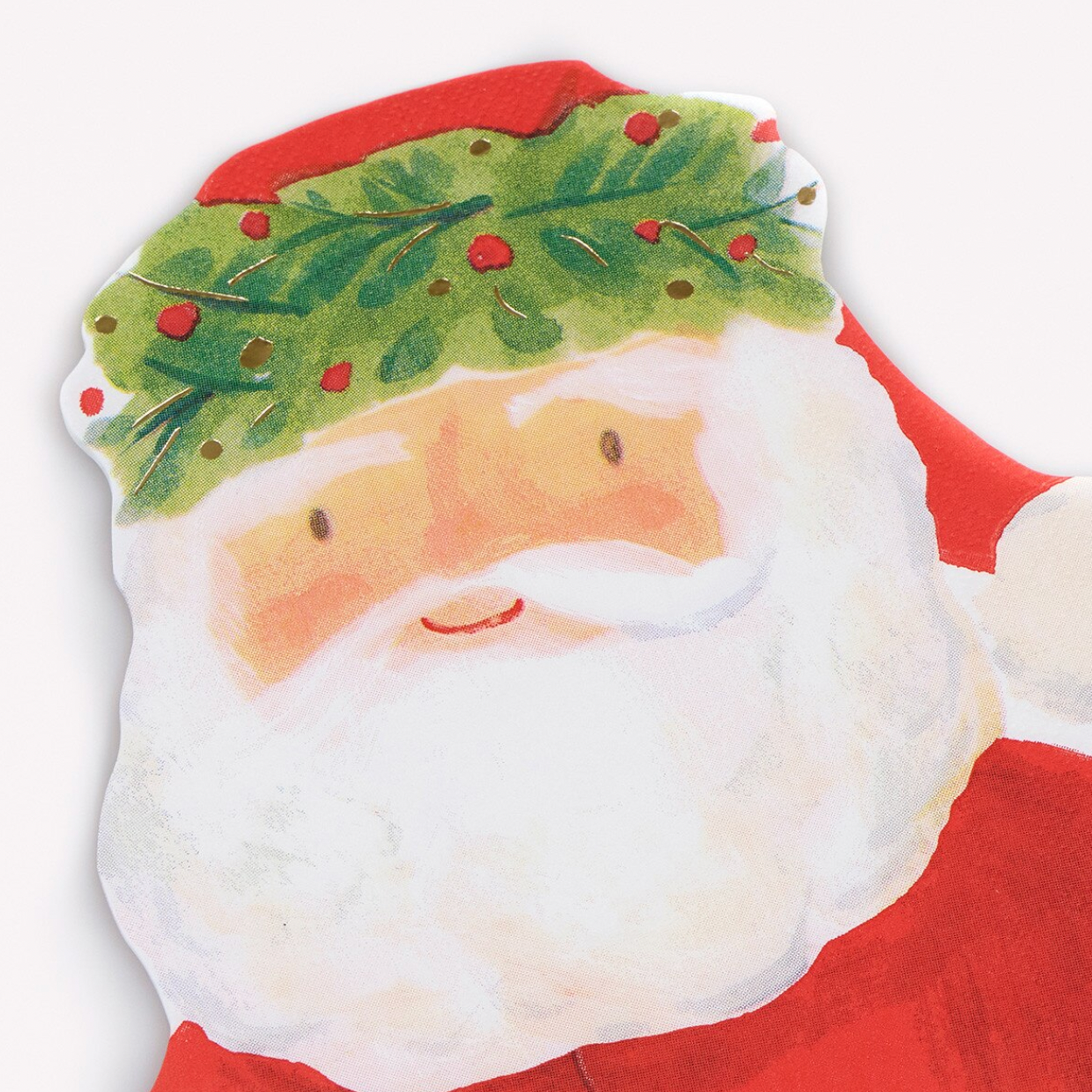 A die-cut Christmas illustration featuring Santa Claus's face, with a white beard, red suit, and green holly with red berries on a white background.
