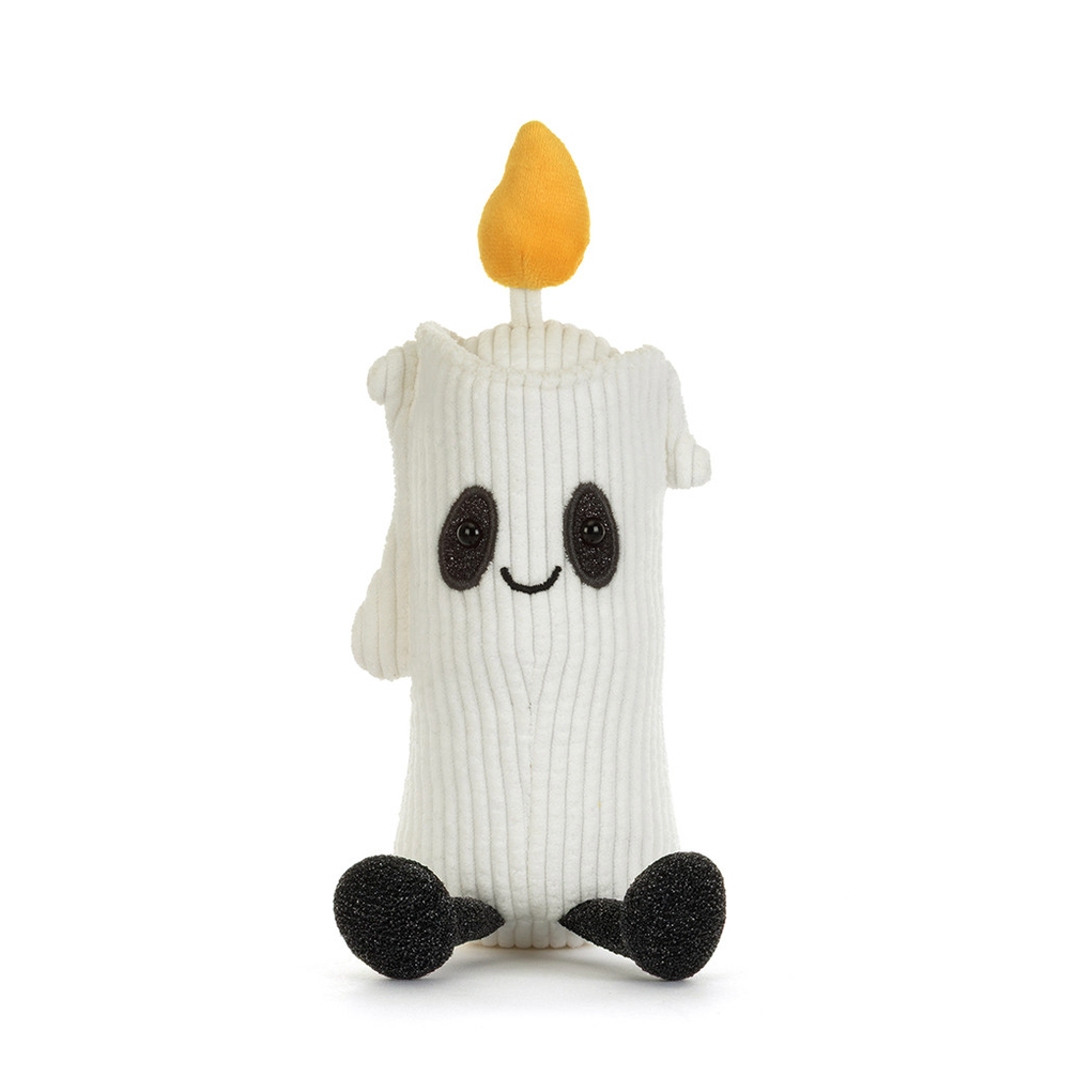 A white ribbed knit ghost candle plush toy with a yellow-orange flame on top, black embroidered eyes and smile, and black feet, shown against a plain white background.
