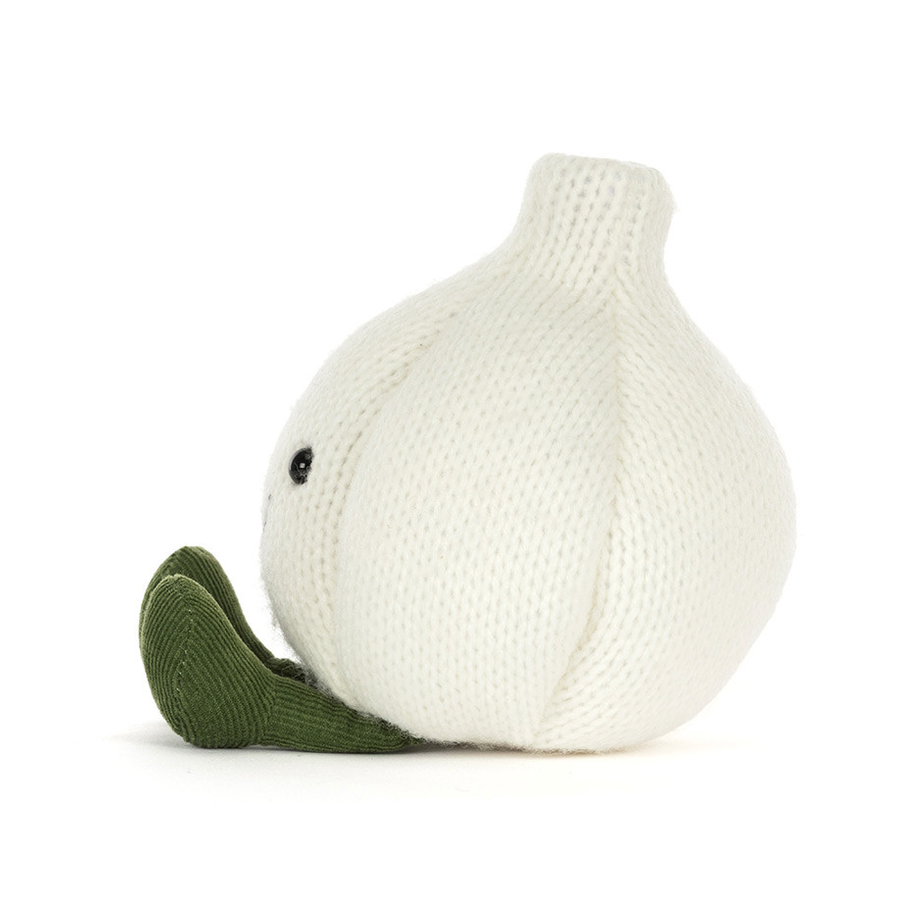 A knitted garlic plush toy in off-white with a dark green stem, shown in profile against a plain white background.