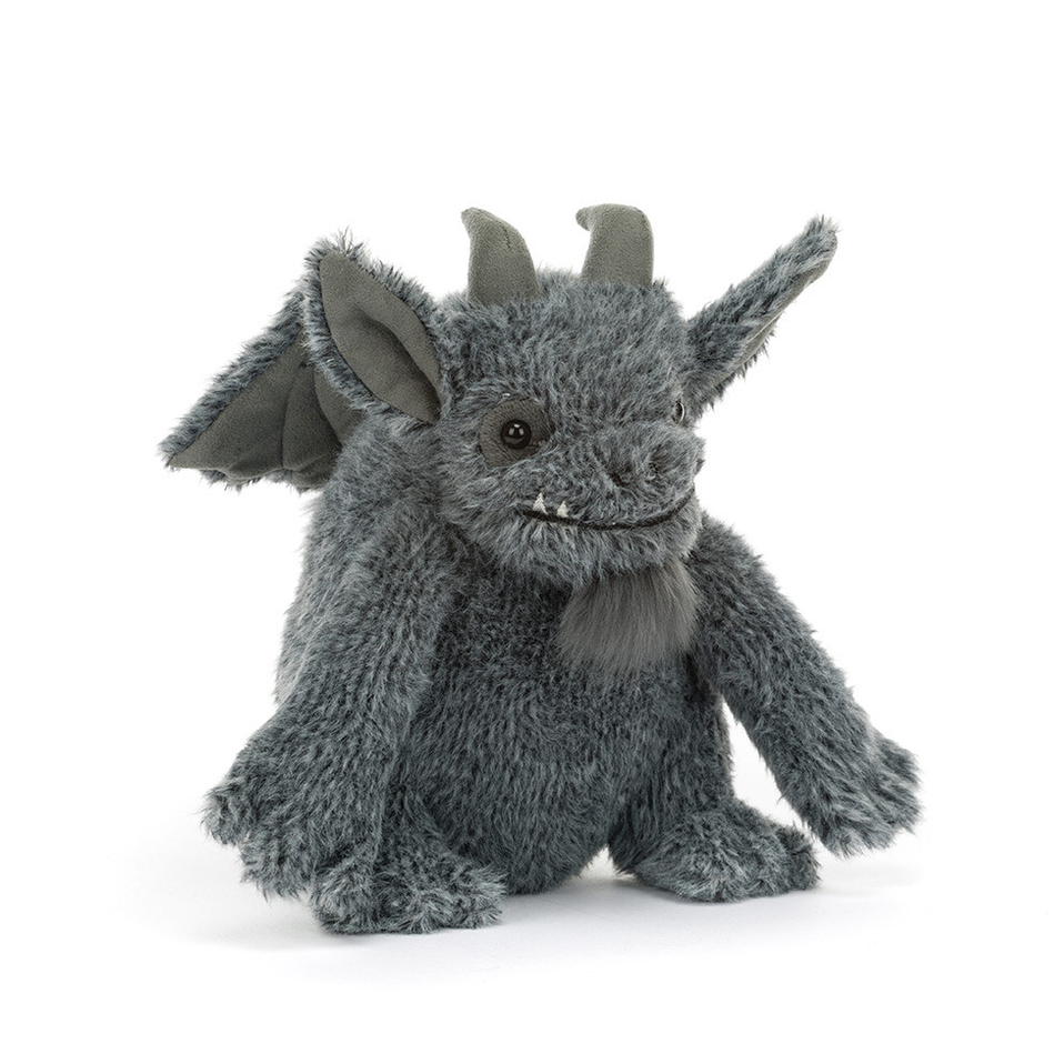 A small gray plush dragon toy with folded wings, small horns, and a soft textured fur-like body, photographed on a clean white background.