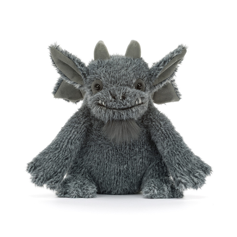 A plush grey dragon toy with large pointed ears, small horns, and a soft furry texture, centered on a clean white background.
