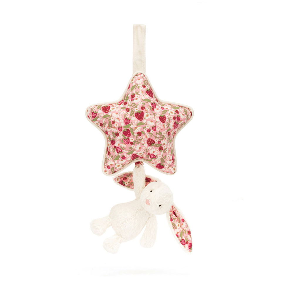 A fabric baby musical toy featuring a star-shaped plush with a red and pink floral print, holding a small white plush bunny with matching floral ears, shown on a solid white background.