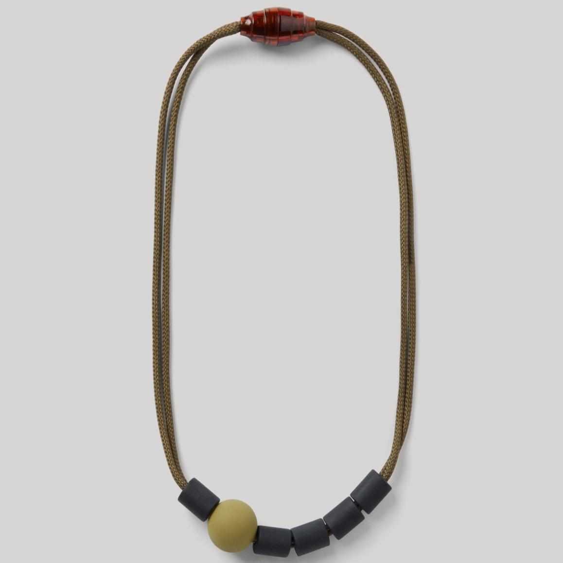 Necklace with beads on a light gray background