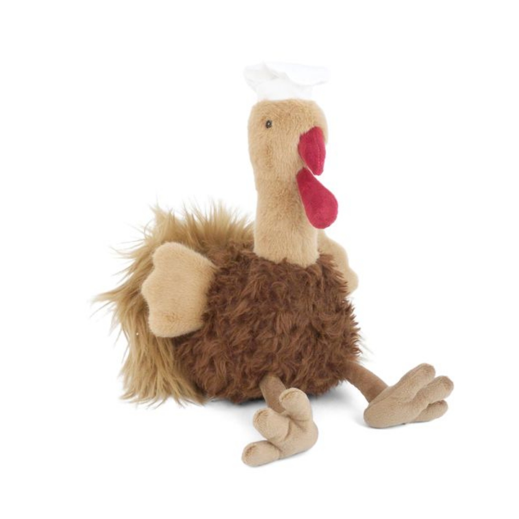Plush toy resembling a turkey with brown feathers and a red comb and a chef's hat on a white background