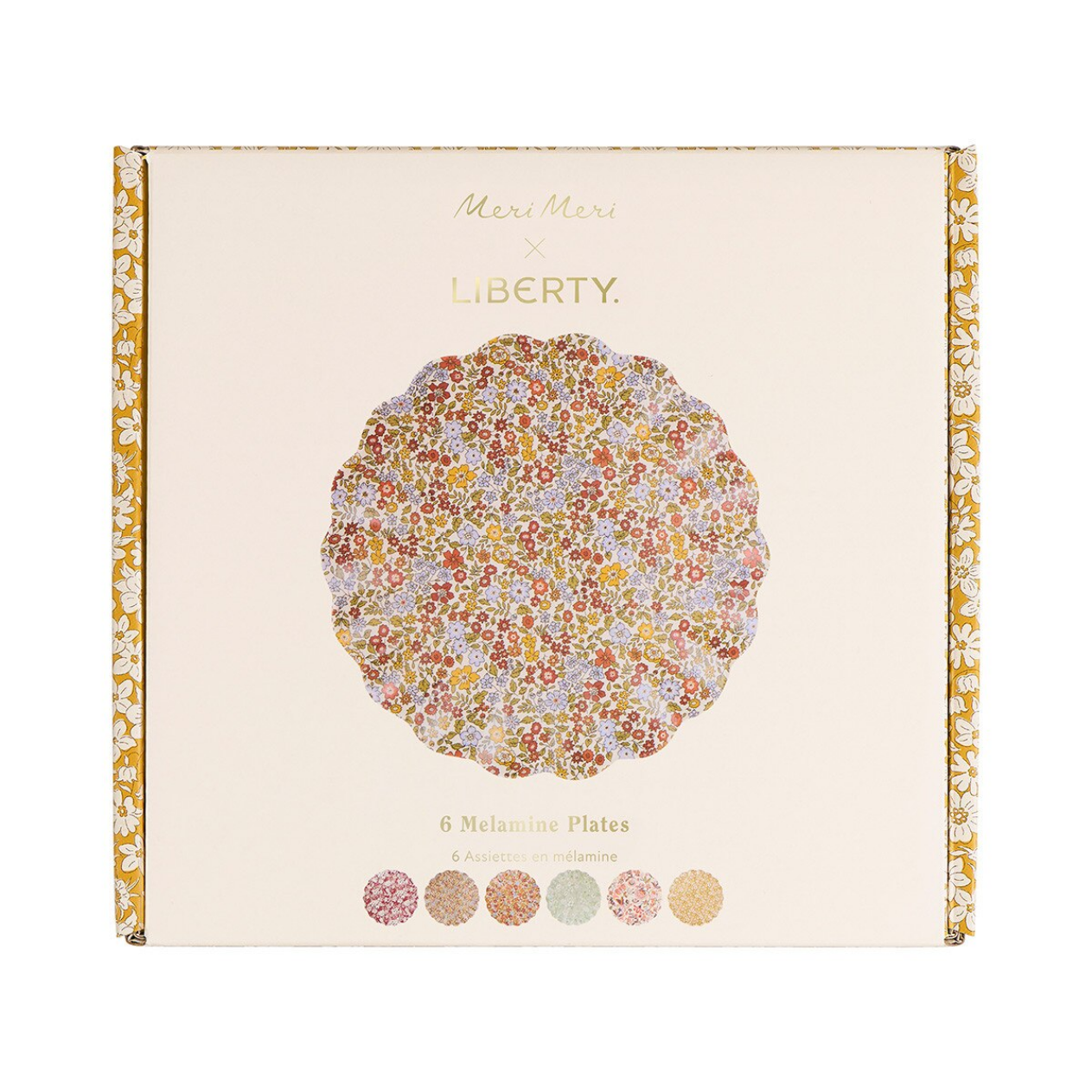 Meri Meri x Liberty collaboration box containing 6 Melamine plates, featuring a central circular floral pattern in warm tones and six small color swatches at the bottom.
