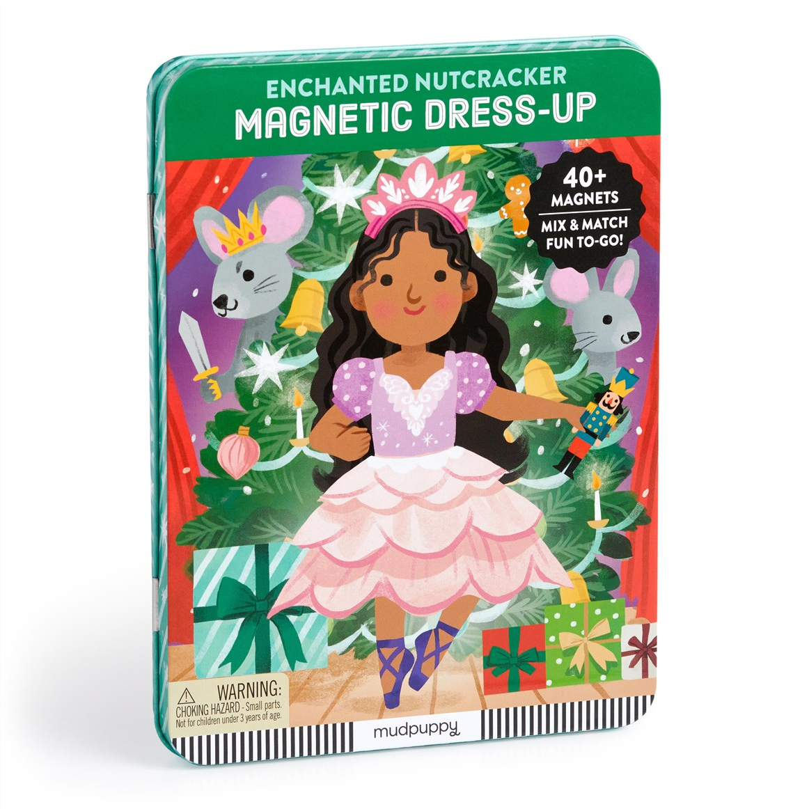 Mudflap Enchanted Nutcracker Magnetic Dress-Up toy in a decorative tin package, featuring an illustrated girl in a pink dress and crown surrounded by holiday characters and gifts, with text including 'MAGNETIC DRESS-UP' and '40+ MAGNETS'.