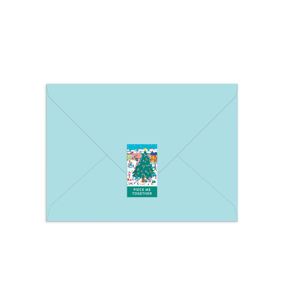 A light blue envelope centered on a white background, with a small colorful illustrated sticker or label on the front that reads 'PIECE ME TOGETHER'.