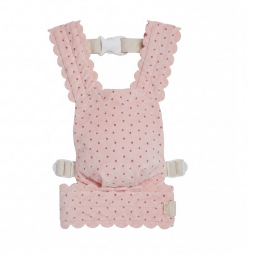 A pink baby carrier  with a polka dot pattern and scalloped edges, shown on a plain white background.