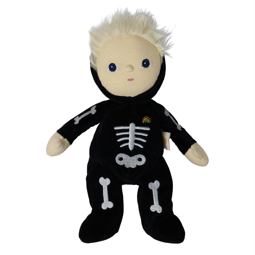 A plush doll with short white hair, blue eyes, and a black onesie decorated with white bone patterns and a small rainbow emblem on the chest, shown against a plain white background.