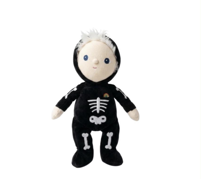 A plush toy doll dressed in a black skeleton costume with white bone graphics, a small rainbow patch on the chest, and white hair, shown against a plain white background.