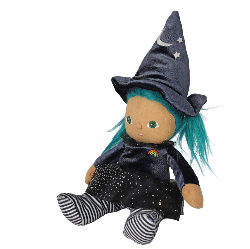 A plush witch doll with bright teal hair, wearing a dark blue velvet pointed hat with embroidered stars and a crescent moon, a dark dress with a rainbow patch, and black-and-white striped socks, photographed on a plain white background.