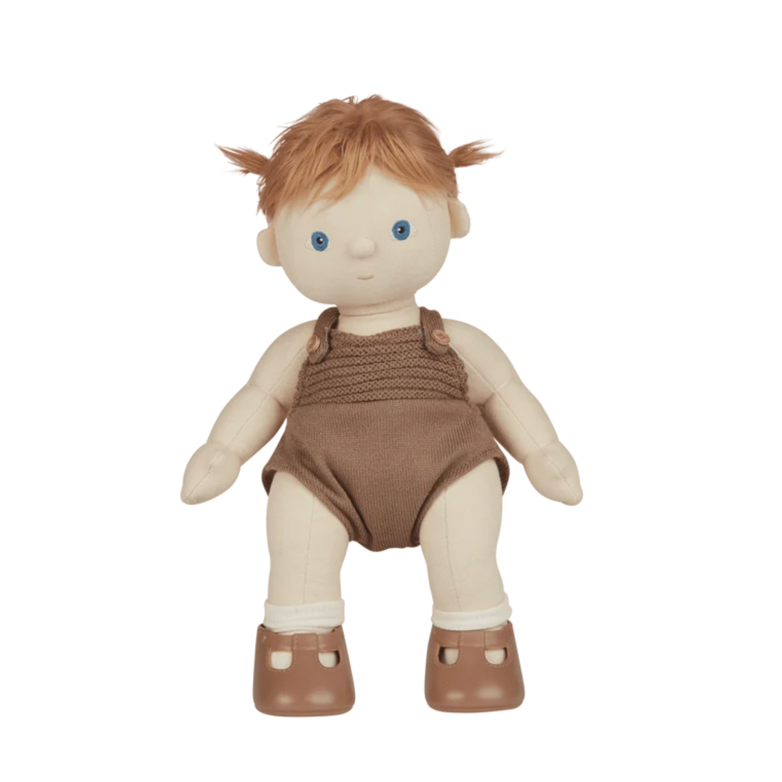 A soft fabric doll with peach skin, short orange hair in two pigtails, blue eyes, and a brown knit romper with white socks and brown shoes, shown on a plain white background.