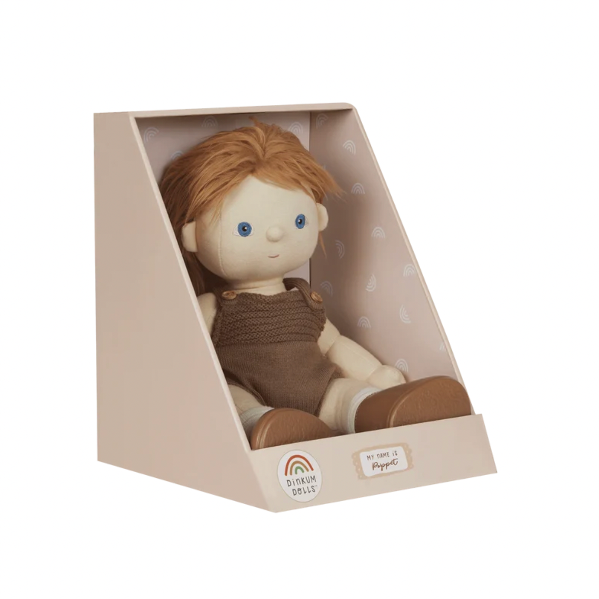 A plush doll with orange-brown hair and blue eyes, wearing a brown knit outfit, displayed inside a beige triangular presentation box on a white background.