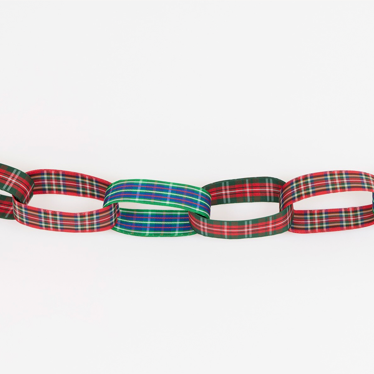 A chain of interlocking paper or ribbon loops in red, green, blue, and yellow tartan plaid patterns, arranged horizontally against a plain white background.