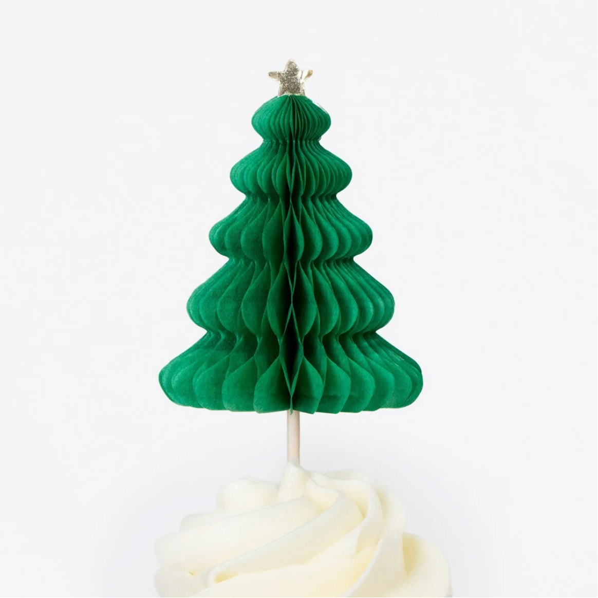 Green honeycomb Christmas tree on a white cake with a white background