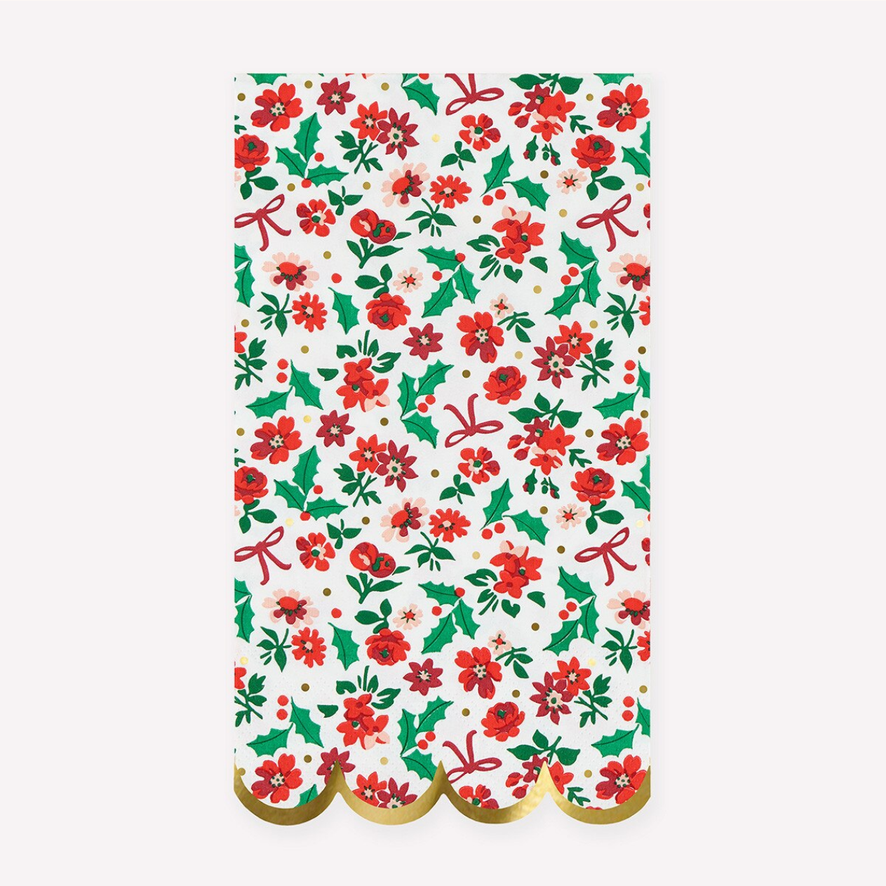 A rectangular sheet of gift wrap or paper with a festive Christmas pattern featuring red poinsettias, green holly leaves, red bows, and small gold polka dots on a white background, finished with a scalloped gold edge.