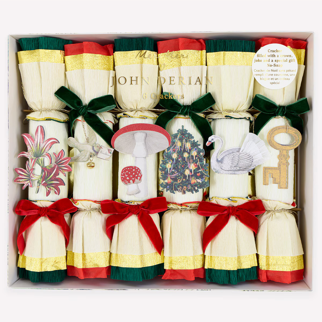Box of John Derian Christmas crackers with decorative designs and ribbons.