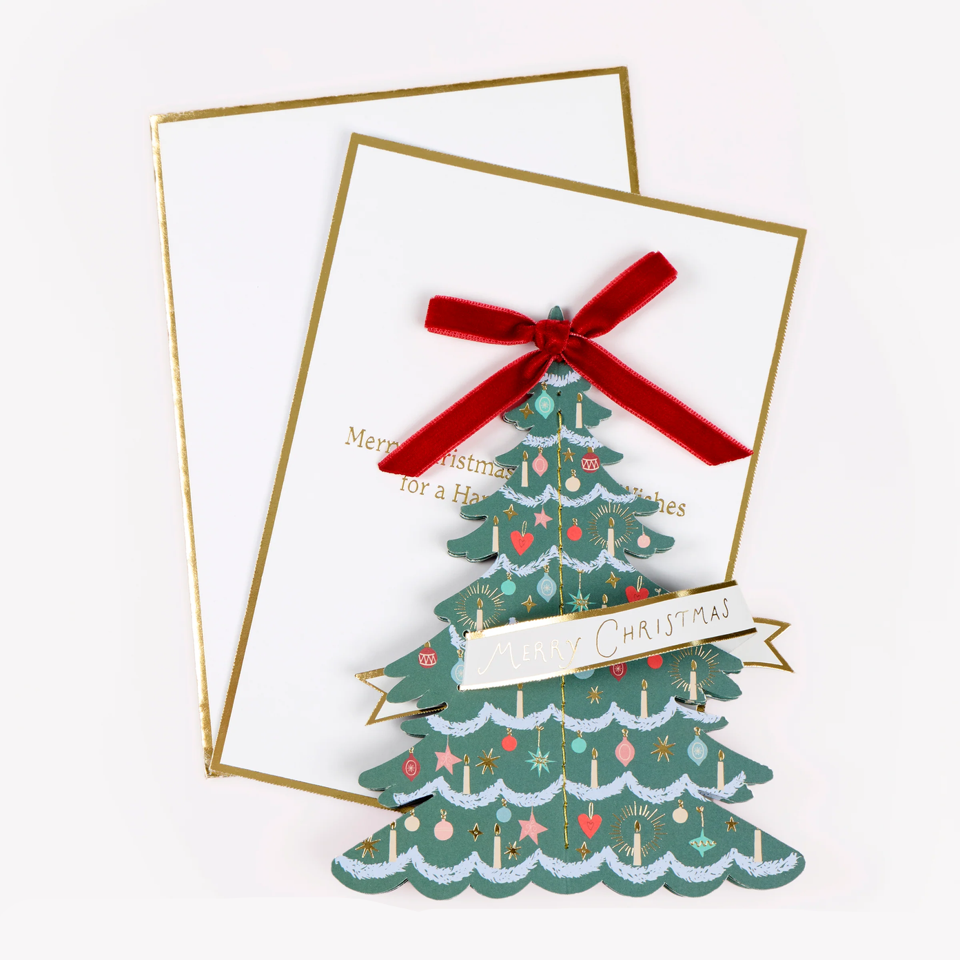 A festive Christmas greeting card set with a layered green Christmas tree design, a red velvet ribbon bow, and gold foil borders on a white background.