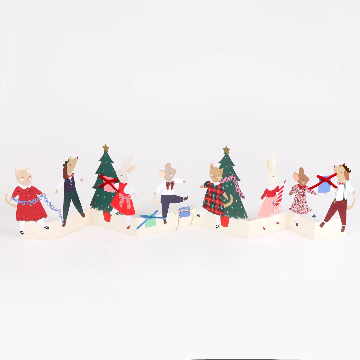 A set of Christmas-themed paper pop-up toys featuring cartoon animals dressed in holiday clothing, including a cat in a red dress, a mouse in a suit, a mouse under a Christmas tree, a rabbit in a pink dress, and a dog in a plaid jacket, arranged on a white background.