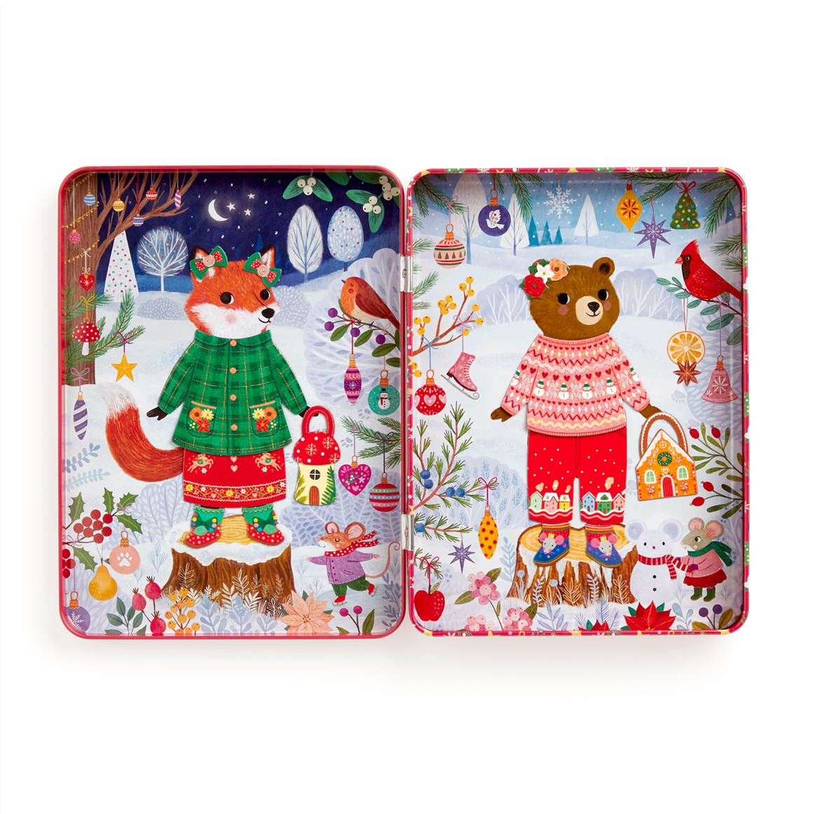 Two square decorative tin boxes shown side by side on a white background, each featuring a whimsical winter forest illustration with a fox and a bear in colorful knit clothing surrounded by ornaments, trees, birds, and holiday details.