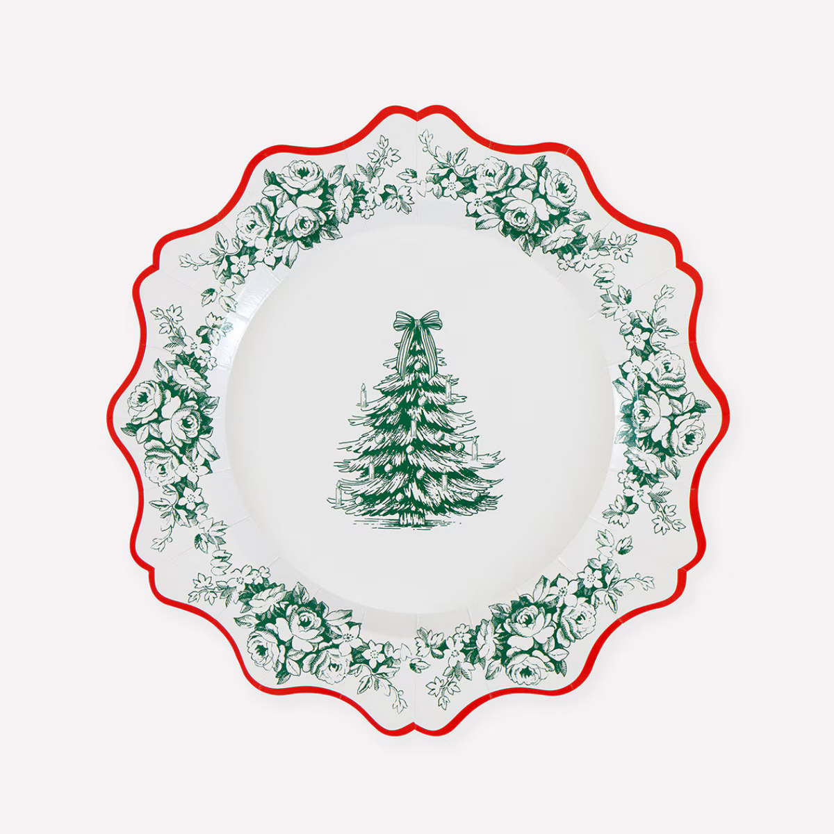 A white ceramic plate with a scalloped rim, featuring a green Christmas tree illustration in the center and a green floral border around the edge, accented by a red rim.