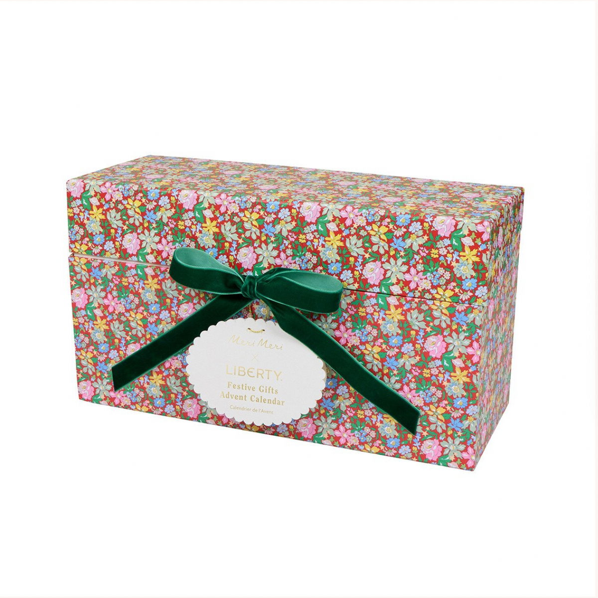 A square gift box wrapped in a dense multicolor floral print, tied with a dark green satin ribbon and bow, and labeled 'Liberty Faux Floral Gift Box'.
