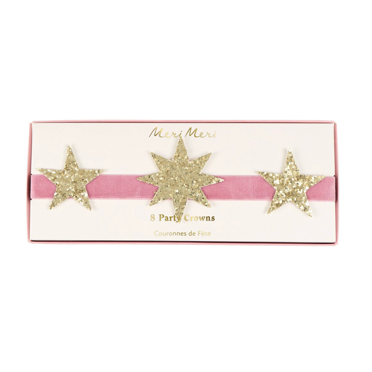 A pink velvet party crown headband with three glittery gold star-shaped crowns, presented in its original white and pink Meri Meri packaging box.