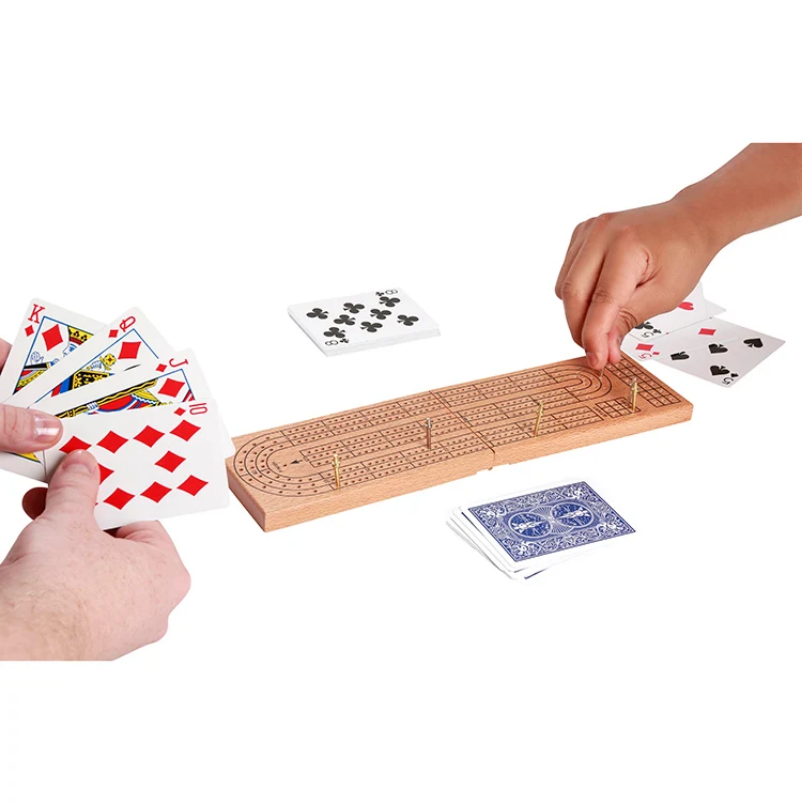Cribbage board with playing cards on a white background
