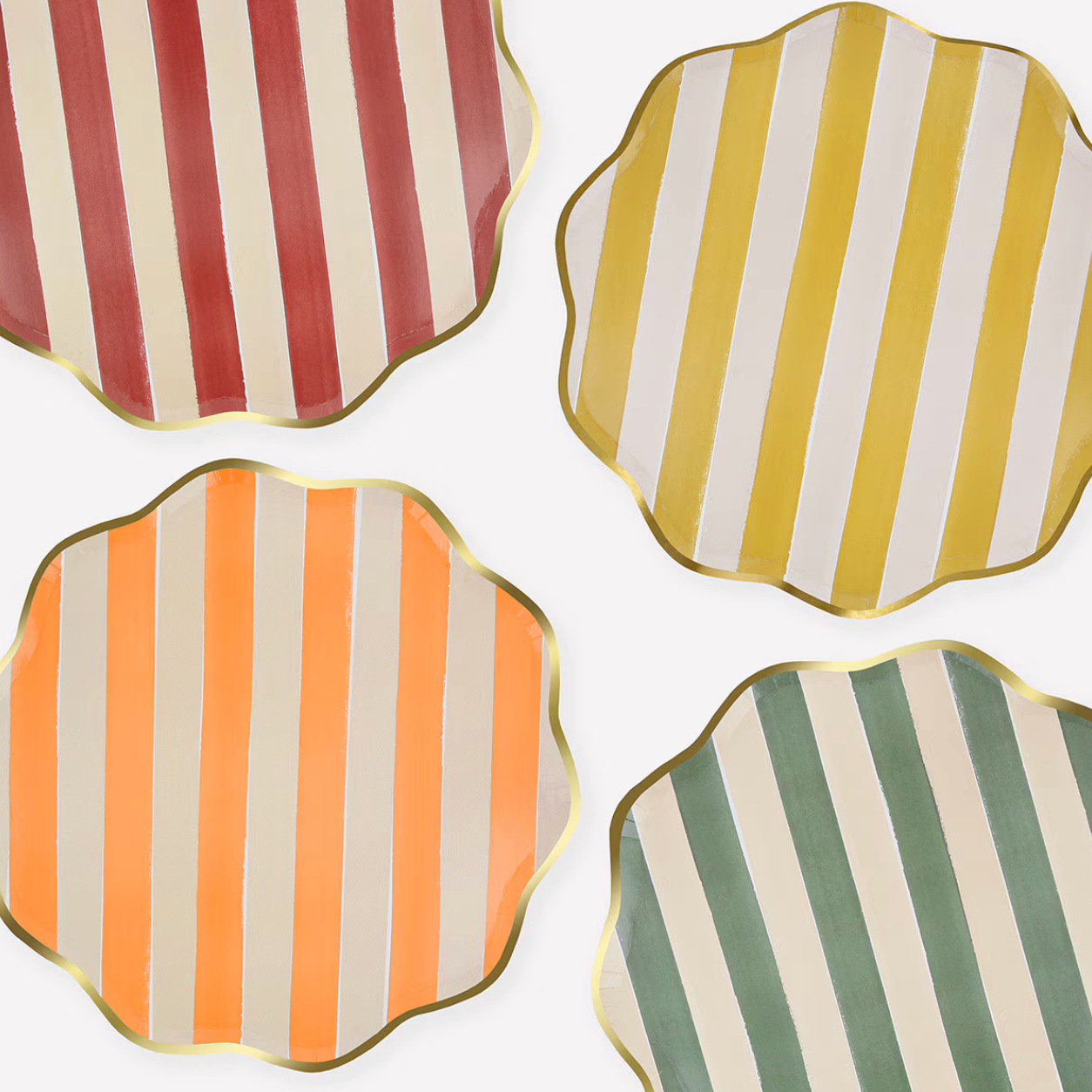 Four scalloped paper plates with vertical stripes, arranged in a 2x2 grid on a white background. The plates feature red and cream stripes, yellow and cream stripes, orange and cream stripes, and green and cream stripes, with gold metallic edges.