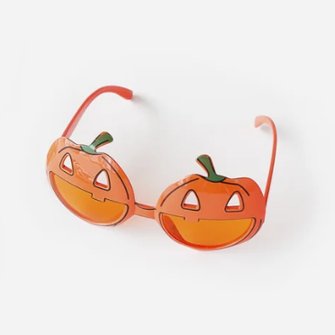 Pumpkin-shaped novelty sunglasses with orange lenses and a small green stem detail, photographed on a clean white background.