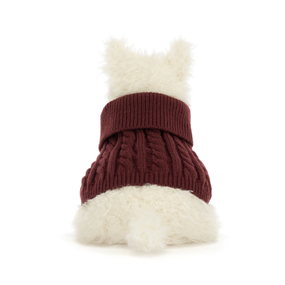 A small white fluffy dog viewed from behind wearing a ribbed knit pet sweater in burgundy, isolated on a white background.