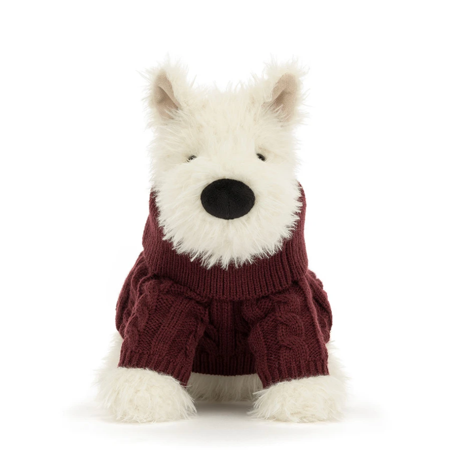 A plush dog toy wearing a burgundy cable-knit turtleneck sweater, 