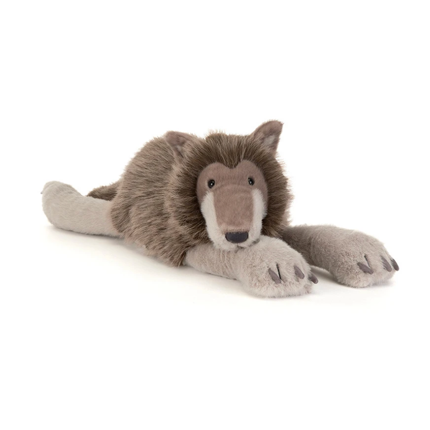 A plush stuffed wolf toy lying on its side, photographed against a plain white background. The wolf has brown and gray fur with a pale beige paws and snout.
