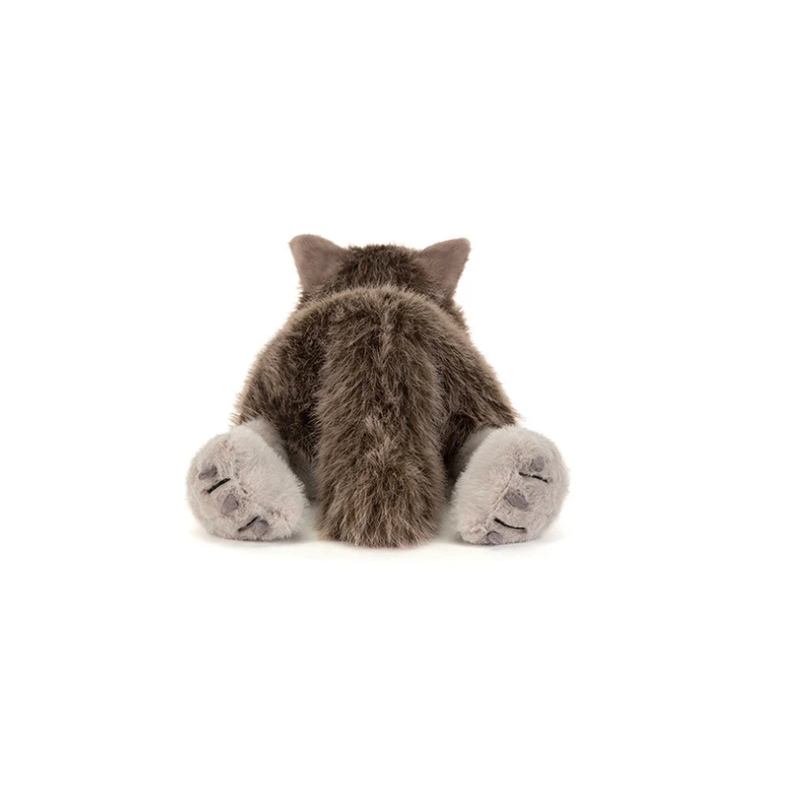 A plush stuffed wolf toy lying on its side, photographed against a plain white background. The wolf has brown and gray fur with a pale beige paws and snout.
