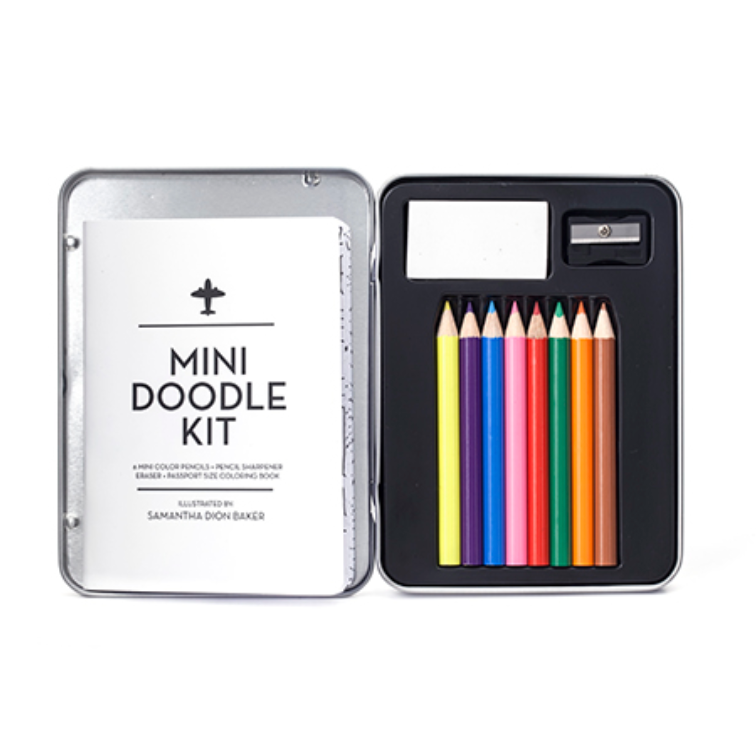 A mini doodle kit shown open on a white background, with a silver metal tin on the left labeled 'MINI DOODLE KIT' and a black tray on the right holding six colored pencils and a small eraser.