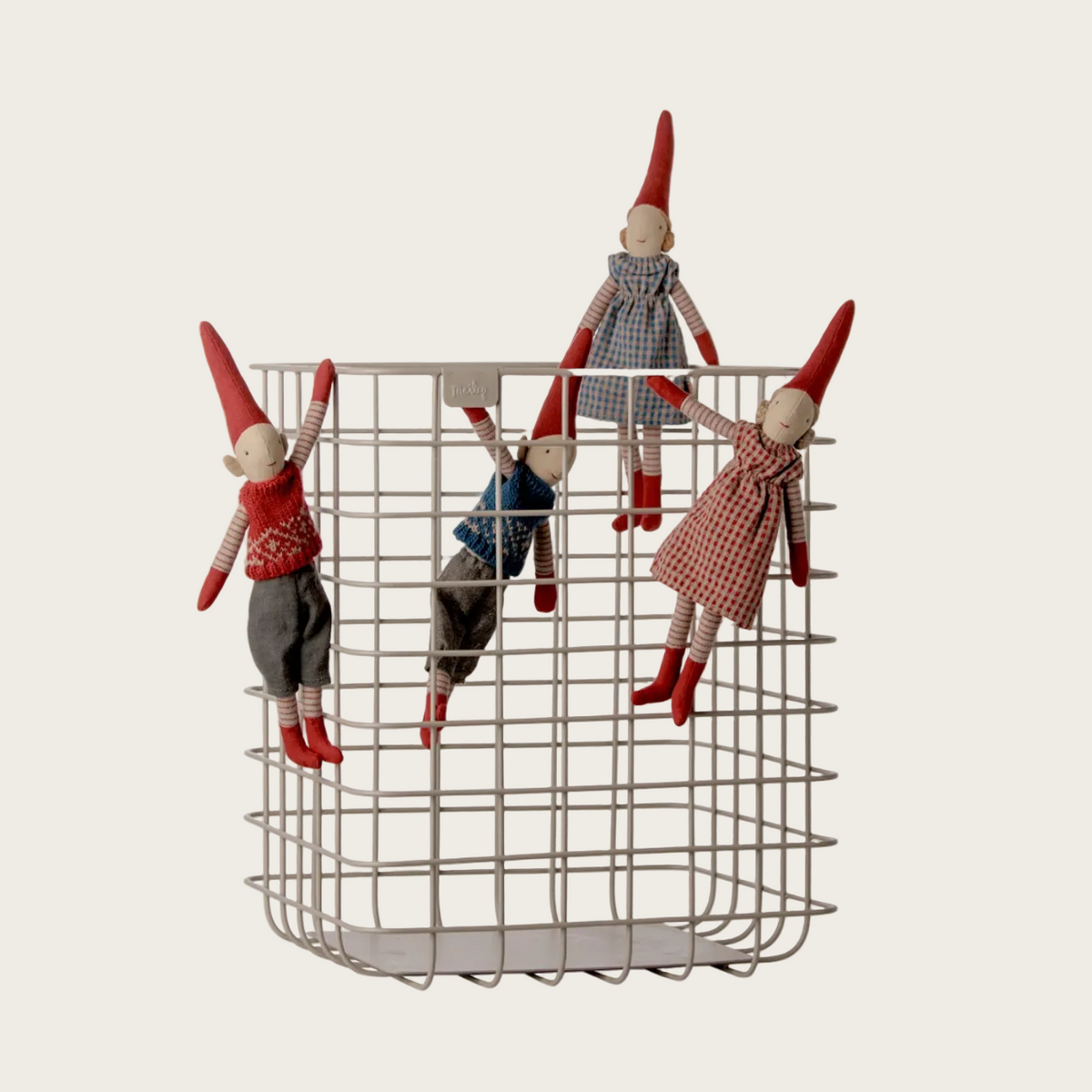 A  set of small gnome figurines hanging from a metal wire basket. 