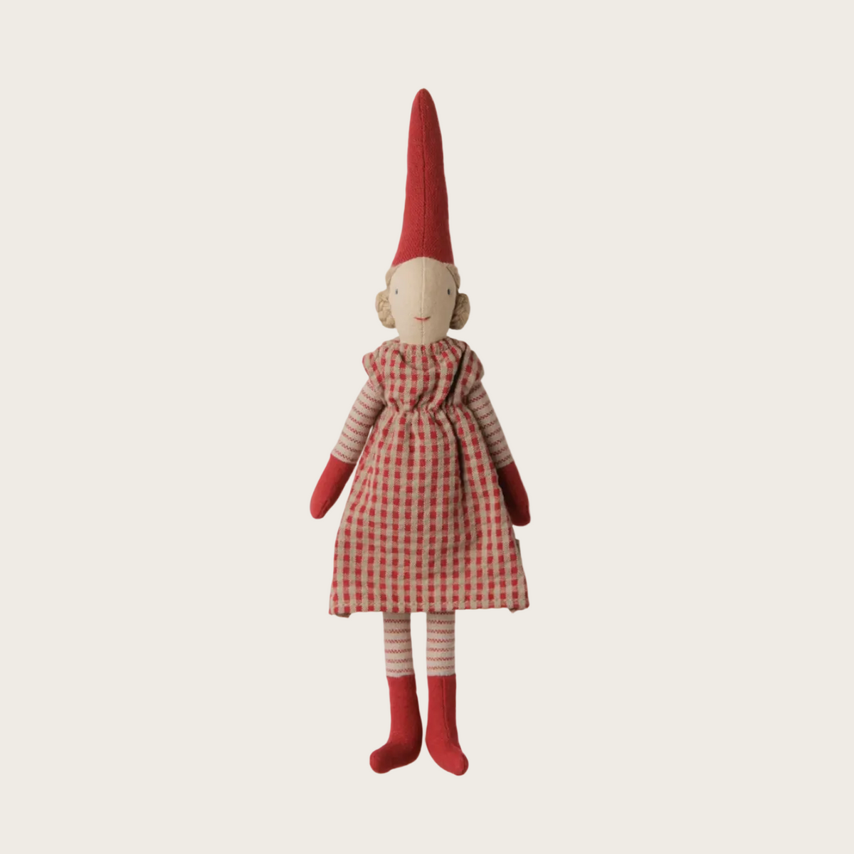 A small fabric doll with a tall red pointed hat, a red-and-white gingham dress, striped red-and-white sleeves and legs, and red mittens and boots, shown on a plain light background.