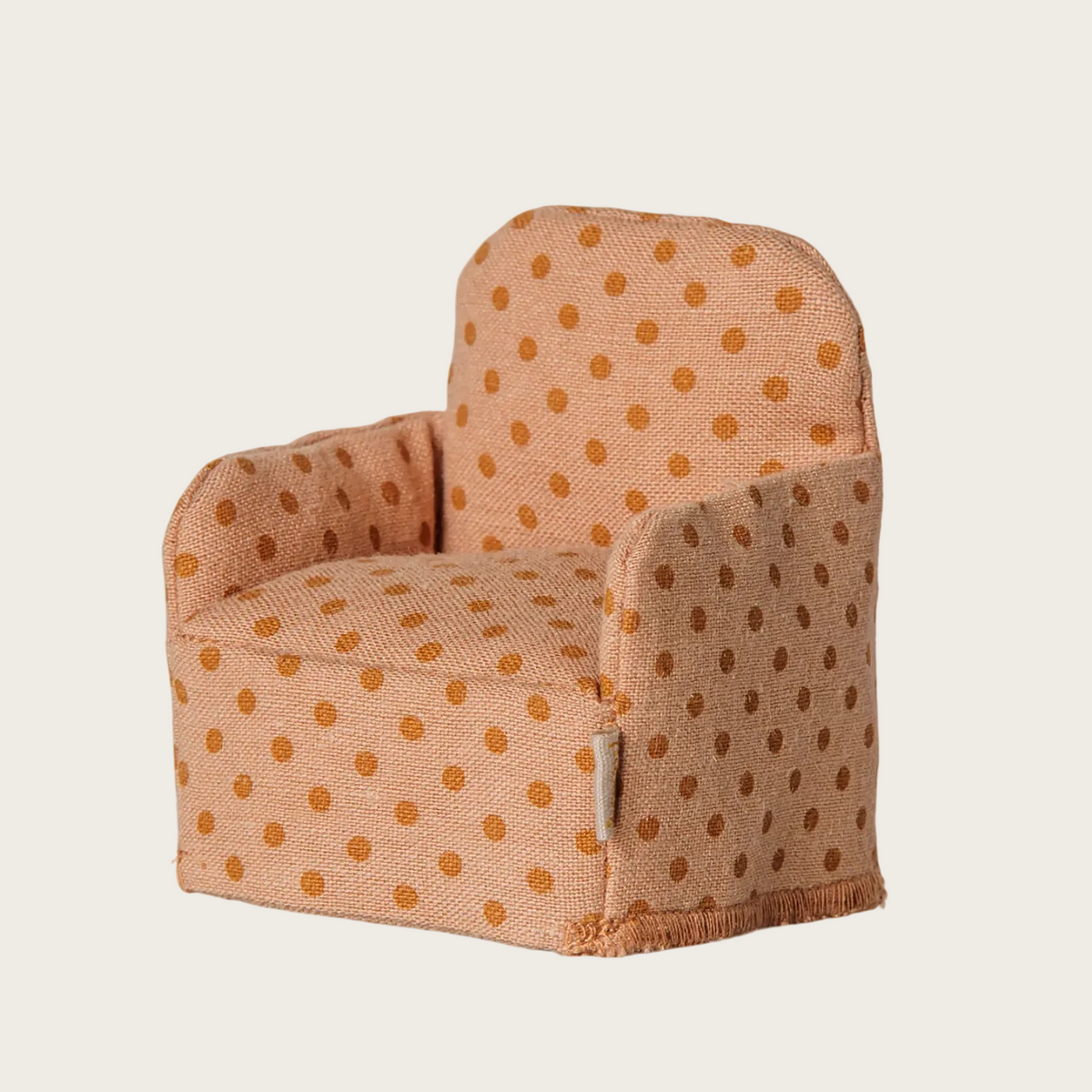 chair with a beige fabric and orange polka dots