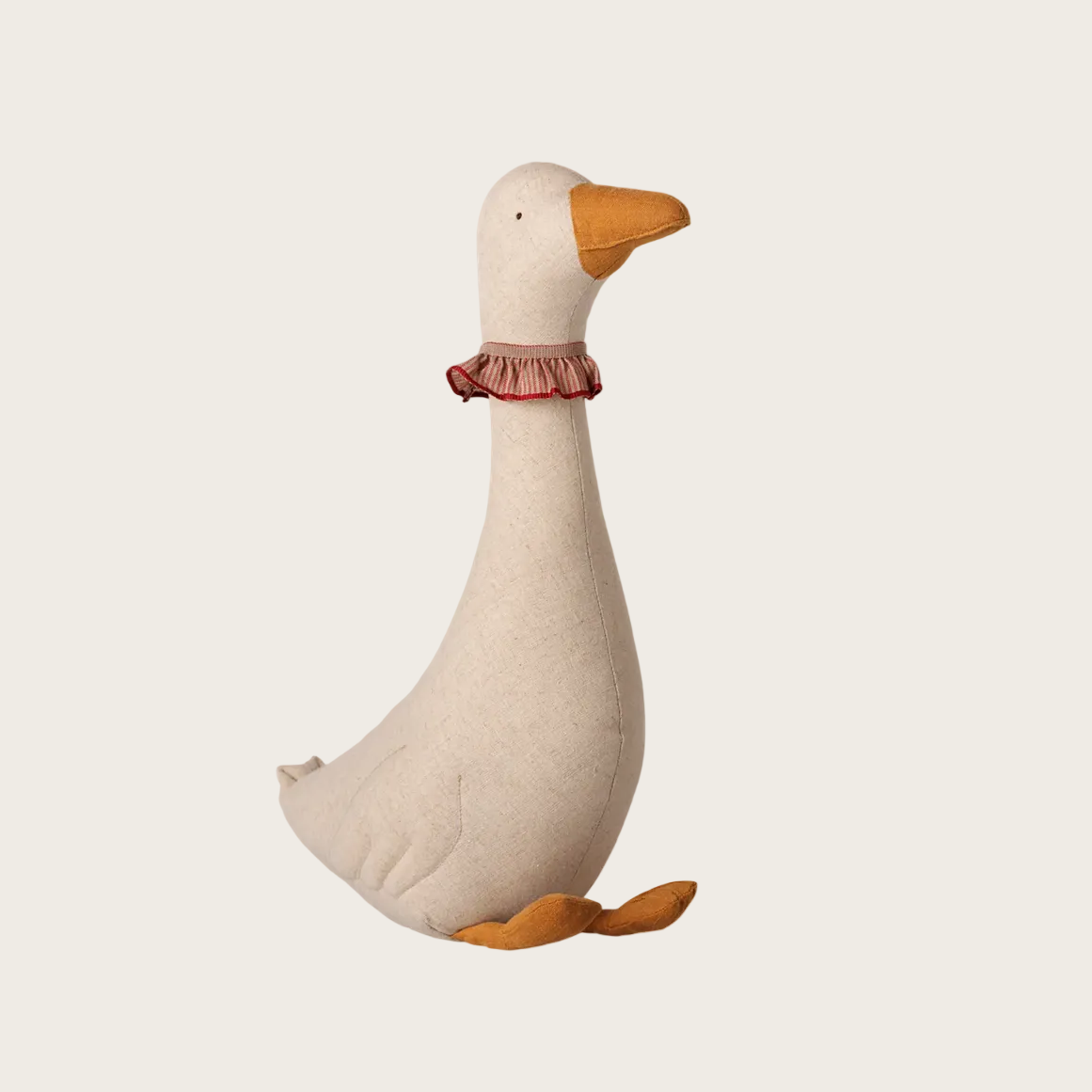 A plush goose toy in a light beige fabric with an orange beak and feet, wearing a small pink ruffled collar, shown on a white product page.