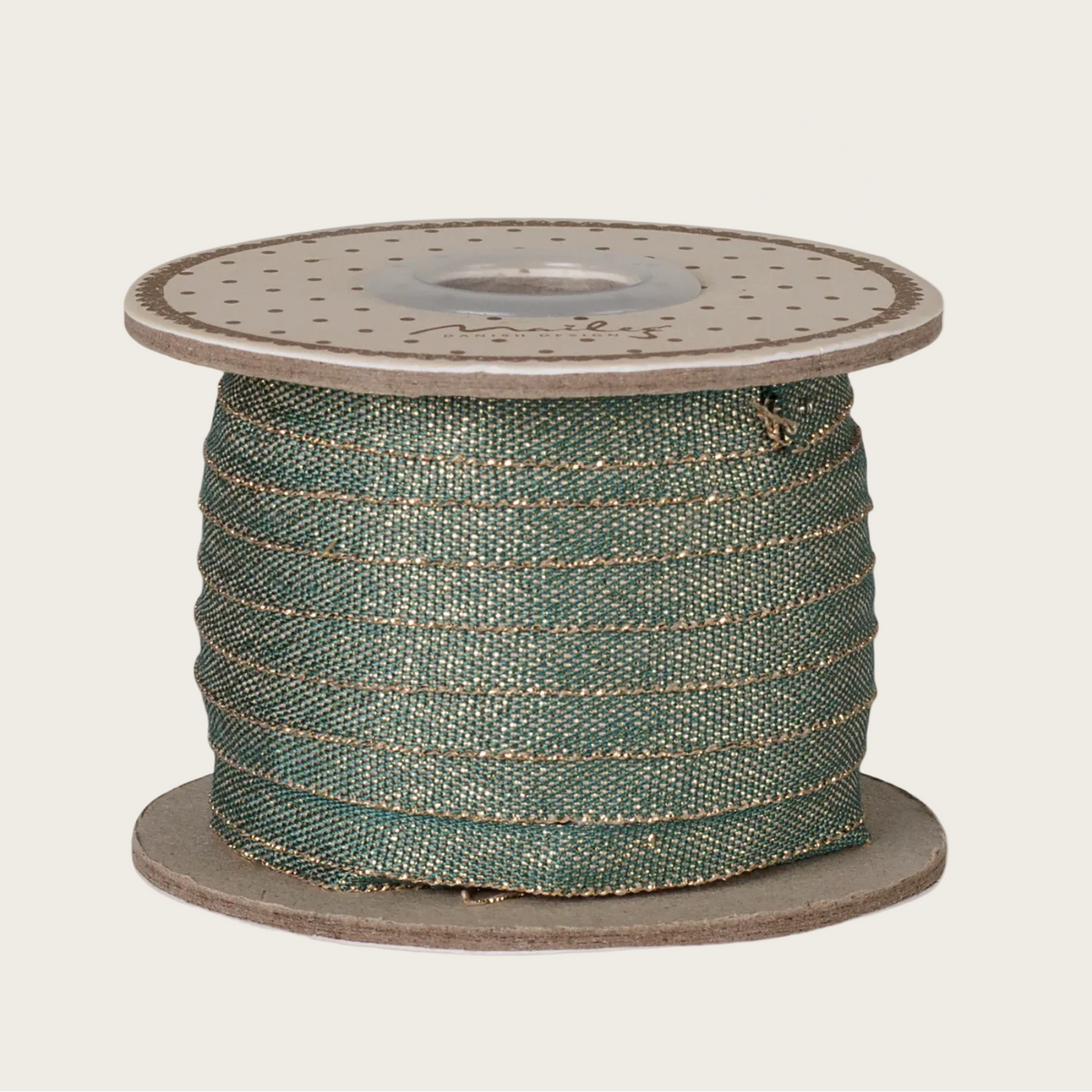 A spool of Maileg Ribbon in green with gold glitter stripes.