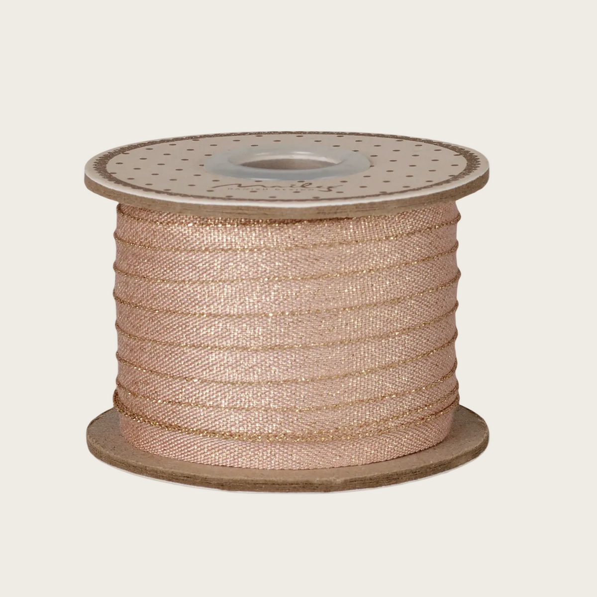 A spool of rose gold metallic ribbon 