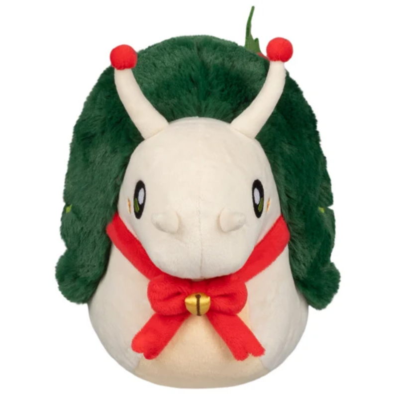 A plush toy shaped like a round white creature with long white antennae tipped in red, a dark green fuzzy leafy headpiece, and a red bow tie with a small gold bell, shown on a plain white background.