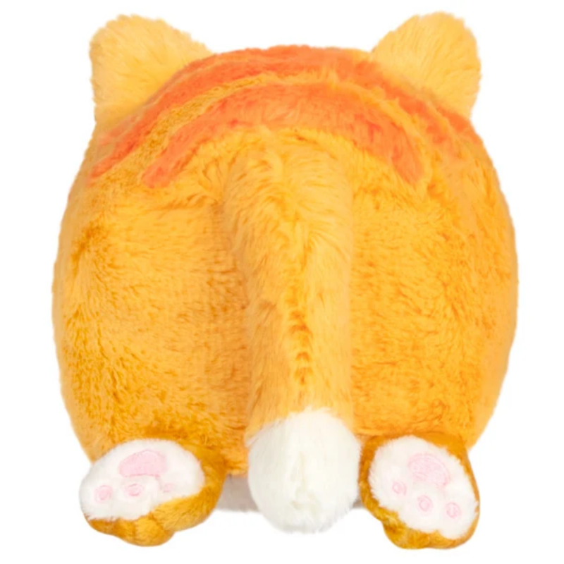 A plush toy shaped like a cat's rear end, shown from behind on a plain white background. The toy is primarily orange with a white tail tip, white paw pads, and a darker orange stripe across the back.