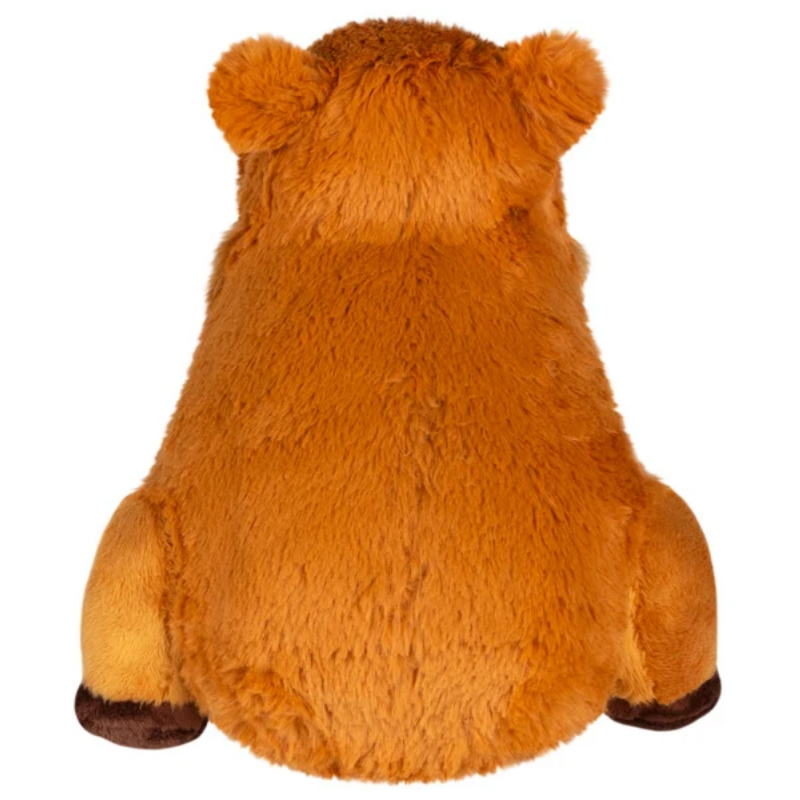 A plush stuffed bear toy shown from the back, featuring golden-brown fur and dark brown paws and ears, isolated on a white background.