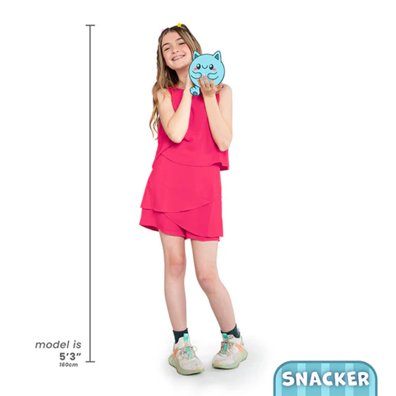 Girl holding a blue plush toy with a white background and 'Snacker' branding.