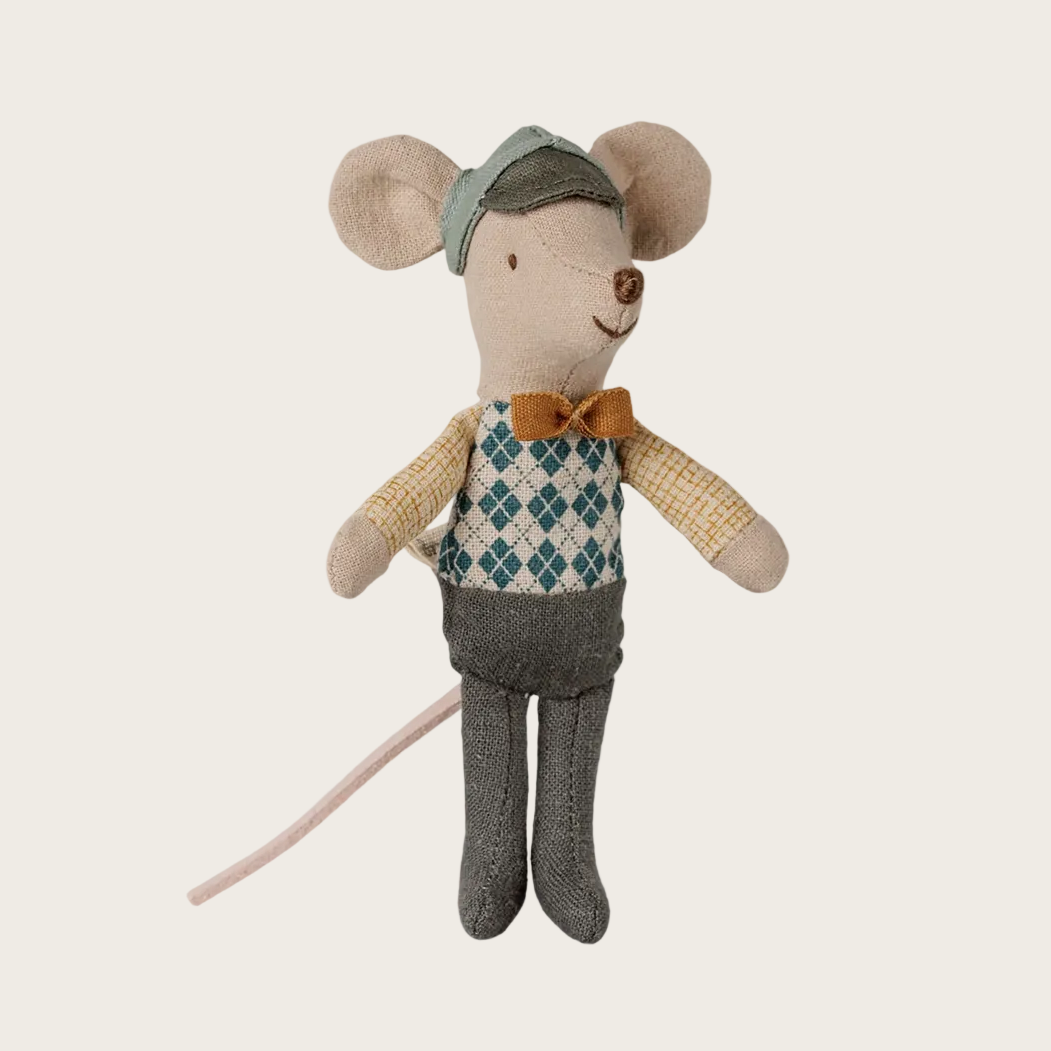 A plush toy doll with large ears, wearing a gray hat, argyle vest, yellow sleeves, gray pants, and a brown bow tie.