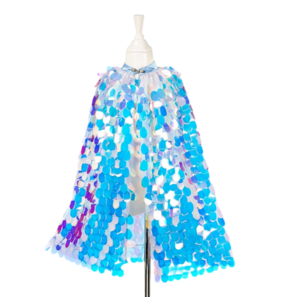 A mannequin displaying a white tulle cape with blue and pink sequins.